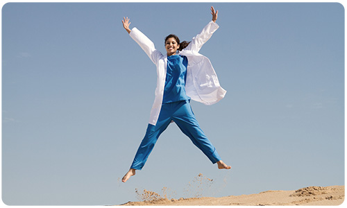A photo of a medical professional jumping.